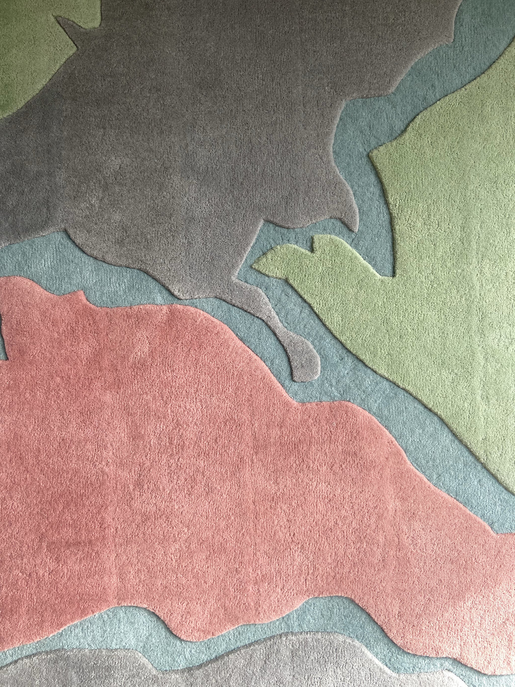 Contemporary abstract rug with green, pink, and grey tones