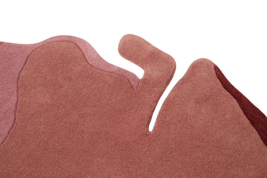 Contemporary handmade pink wool rug with organic petal design