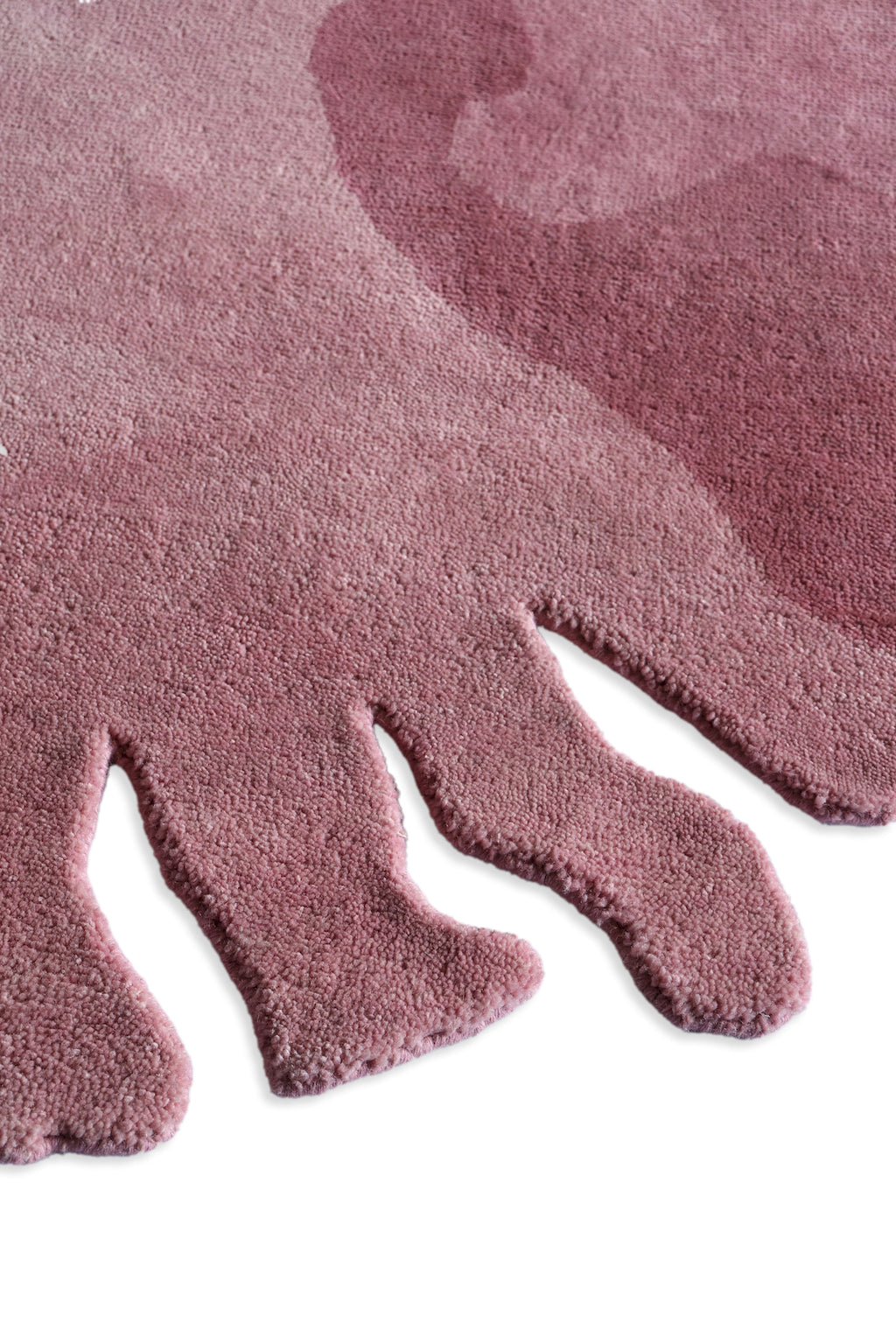 Modern pink flower shaped rug made from New Zealand wool