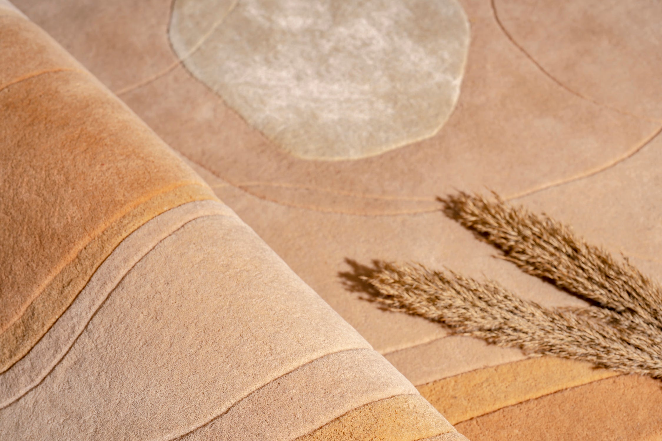 Handmade designer rug with organic pebble inspired shape