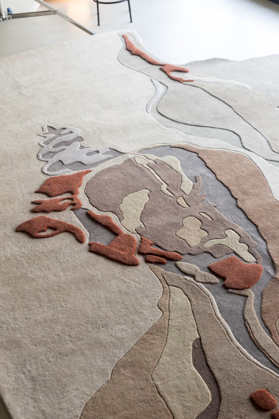 designer wool rug with organic abstract pattern