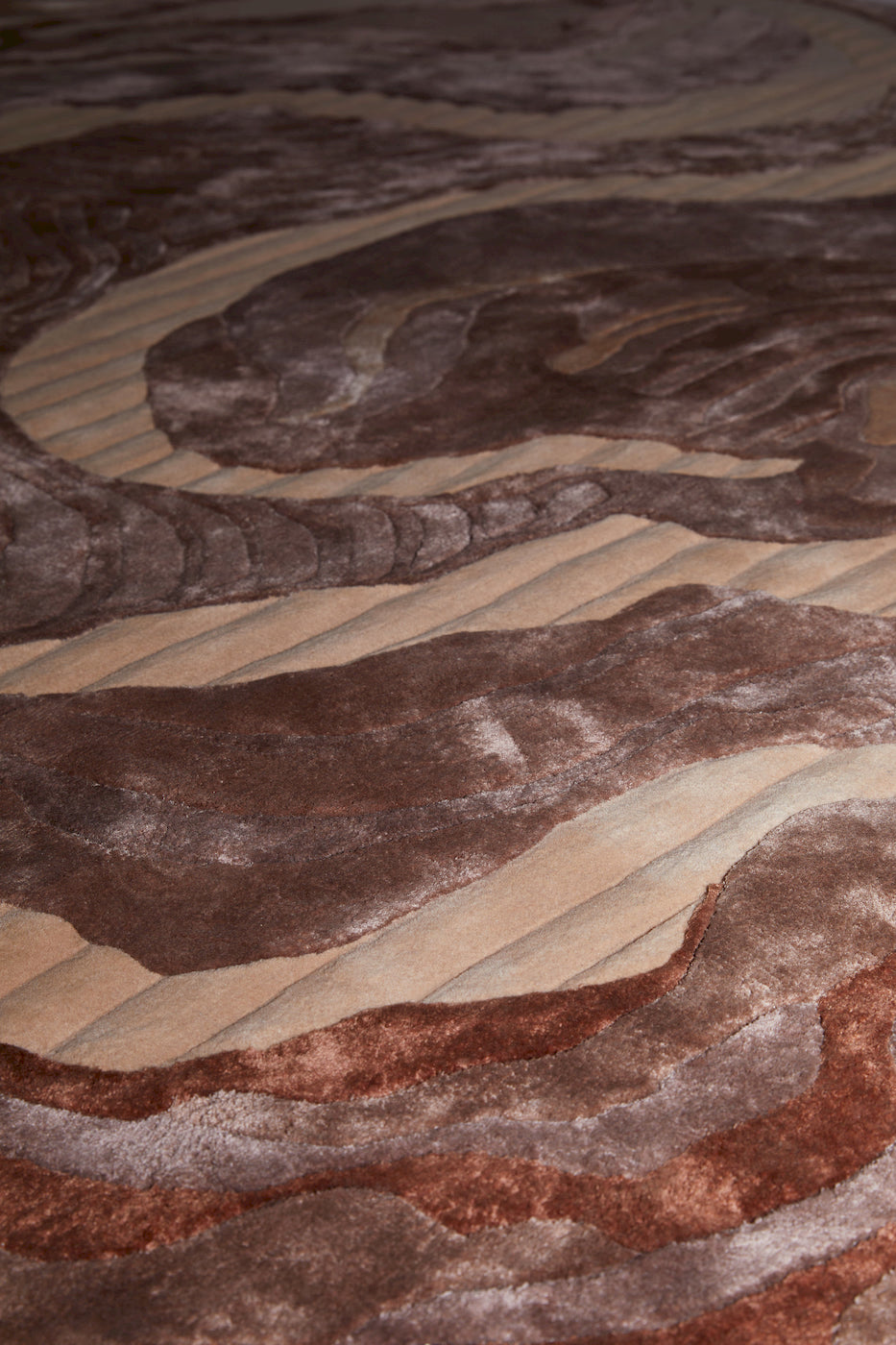 Modern brown abstract rug with layered wavy pattern