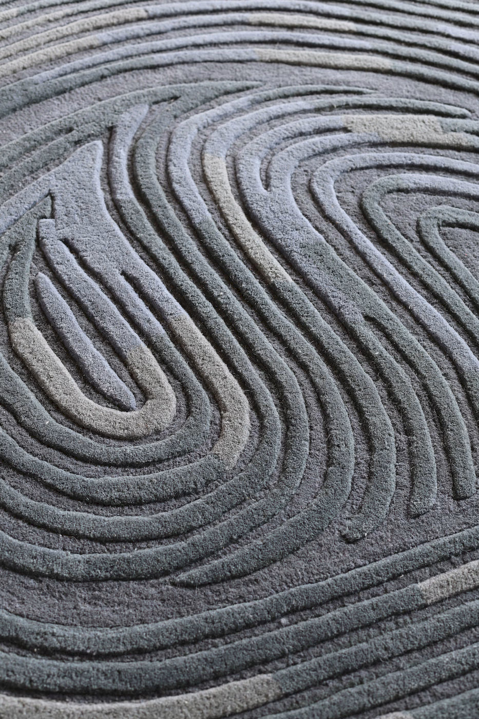 Modern blue wool area rug with maze inspired design