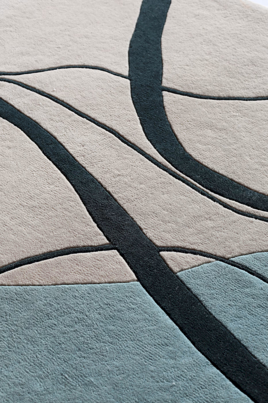 Modern abstract wool rug inspired by coastal colors