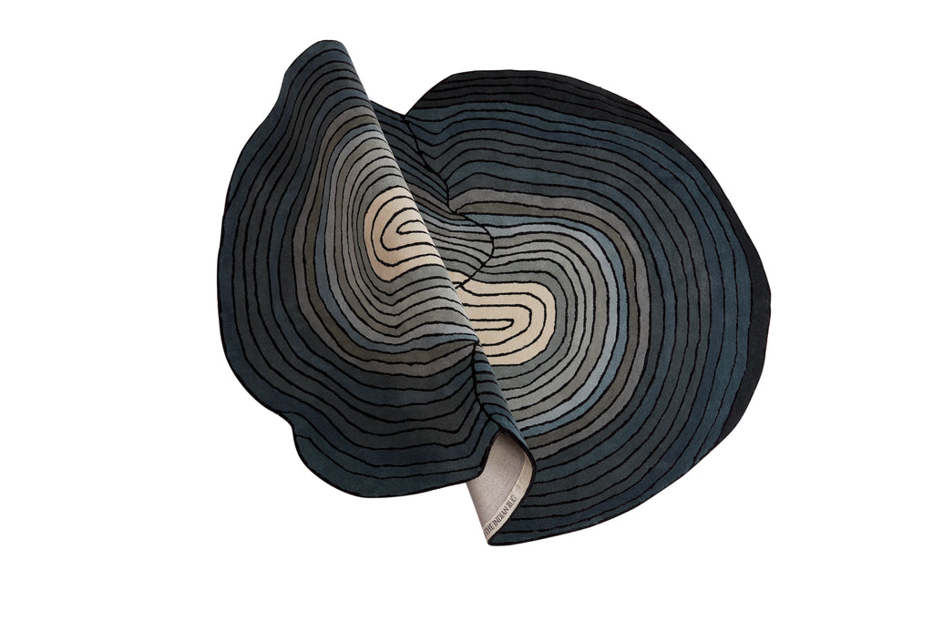 Contemporary designer rug with layered circular lines