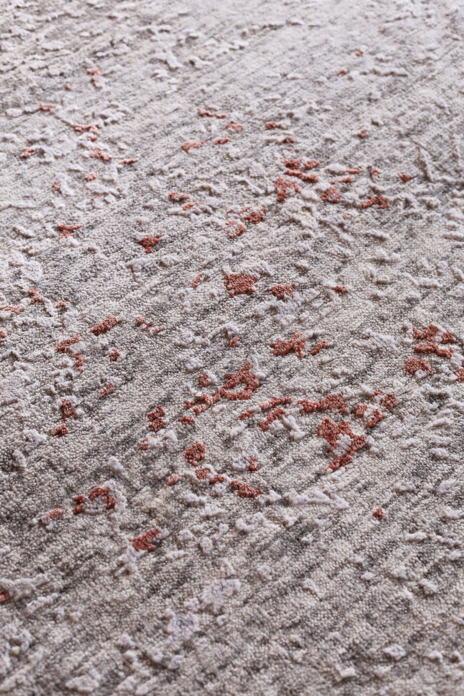 Modern grey and rust abstract rug with textured pattern