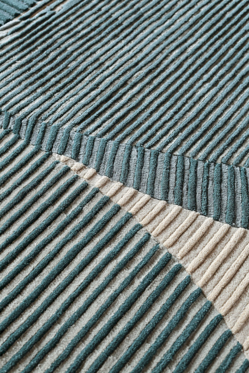 Twirl Teal wool rug with geometric pattern and textured lines