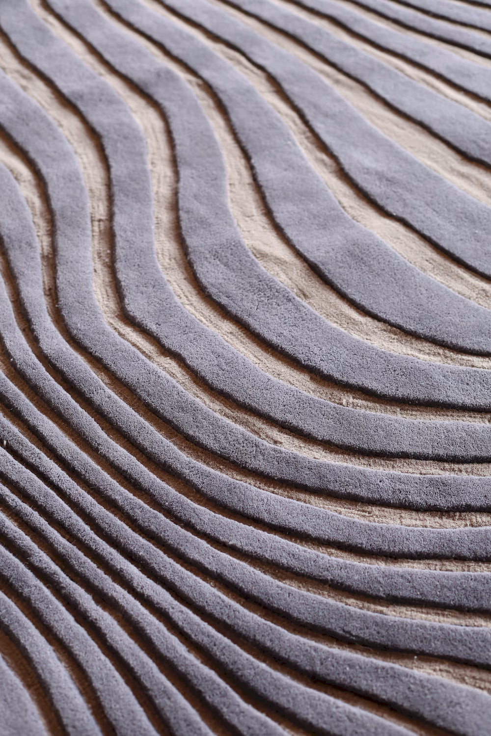 Modern grey and blue wool rug with flowing lines